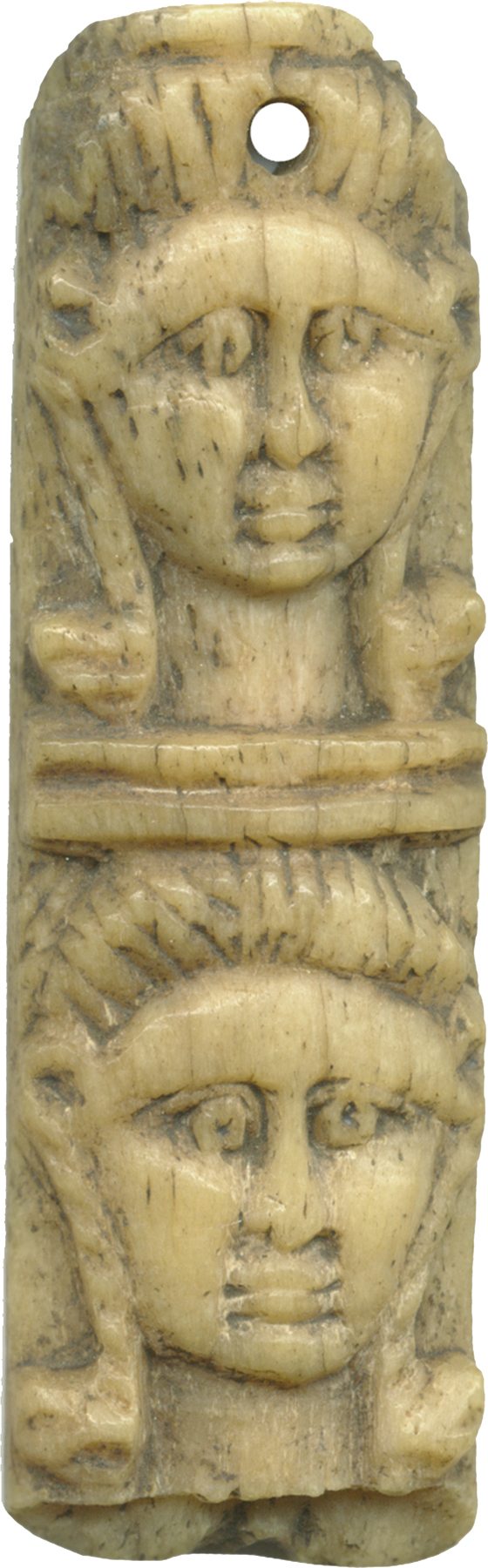 Pair of Egyptian heads of Hathor in a museum collection