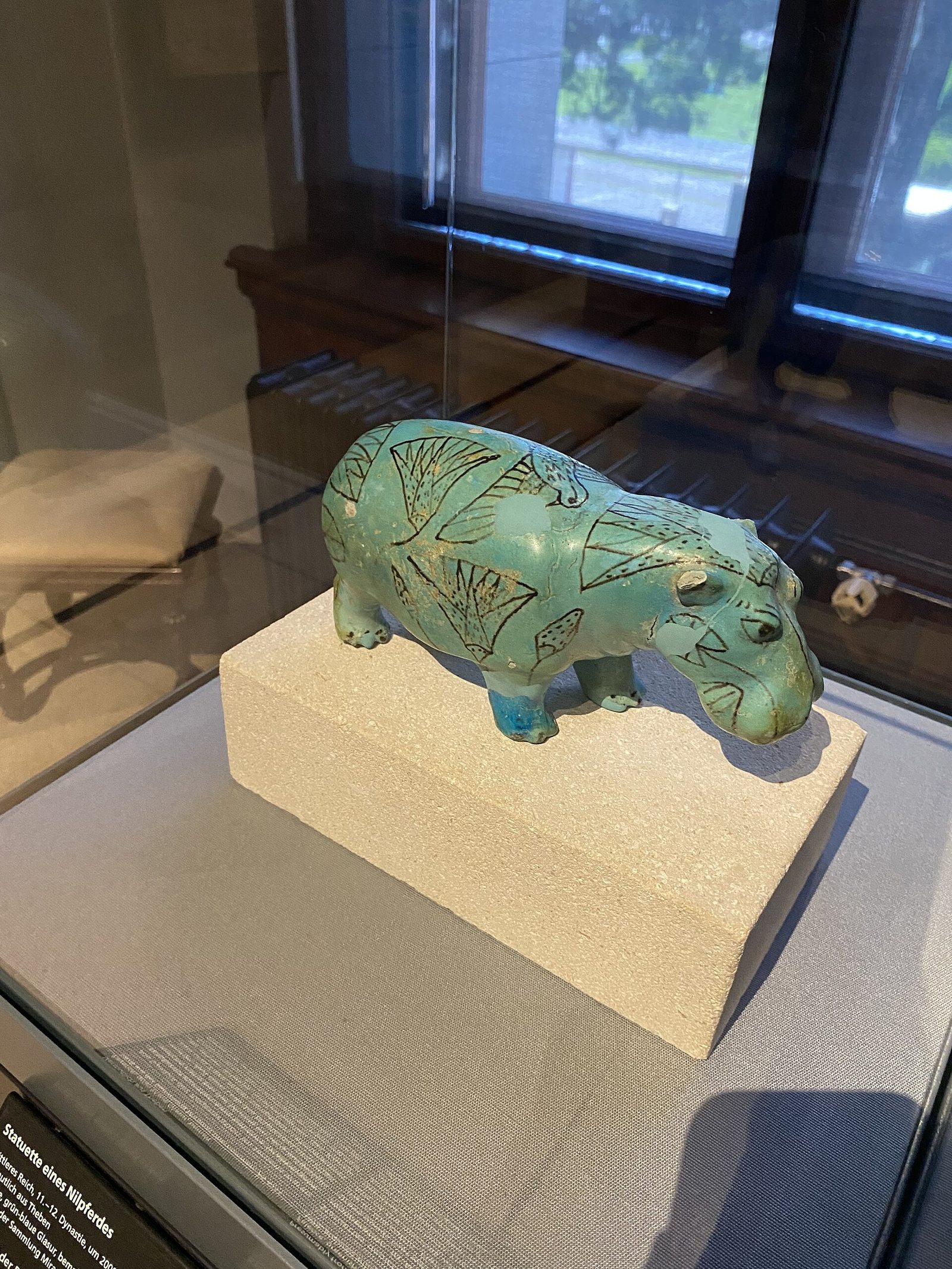 Blue faience Egyptian hippopotamus in a museum collection